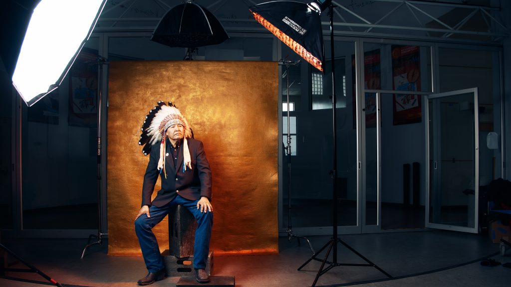 Calgary headshot studio with professional lighting and native headdress model.